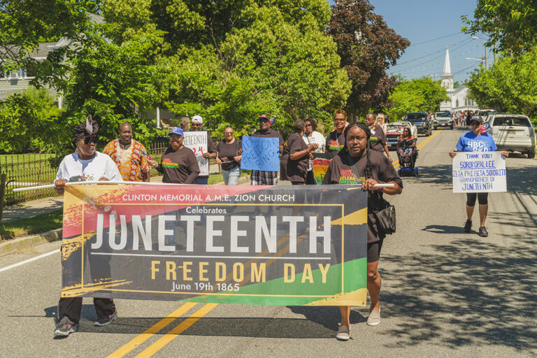 Members of Clinton Memorial A.M.E. Zion Church of Greenport lead the North Fork’s first Juneteenth parade. (Jeremy Garretson photo)