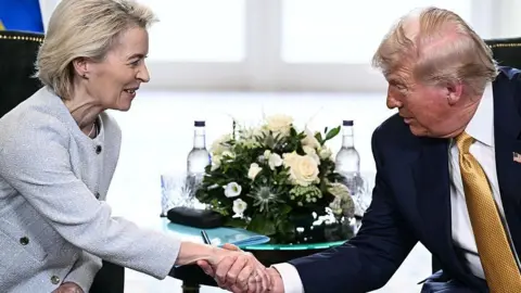 Donald Trump and Ursula von der Leyen shaking hands in Scotland
