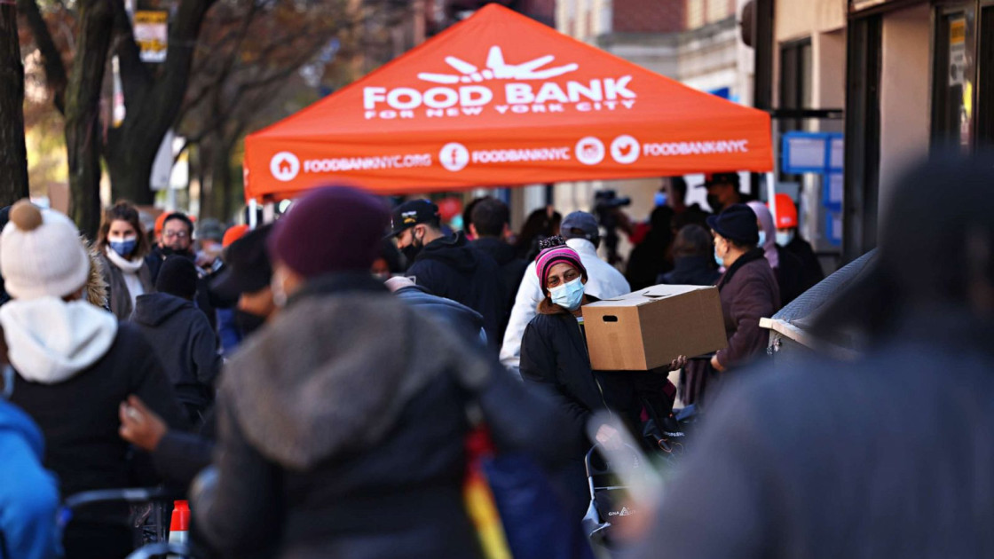 people waiting in line at a food bank