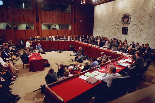 An image symbolizing the mechanisms of checks and balances in foreign policy, with examples like congressional oversight during the Vietnam War and Iran-Contra affair.